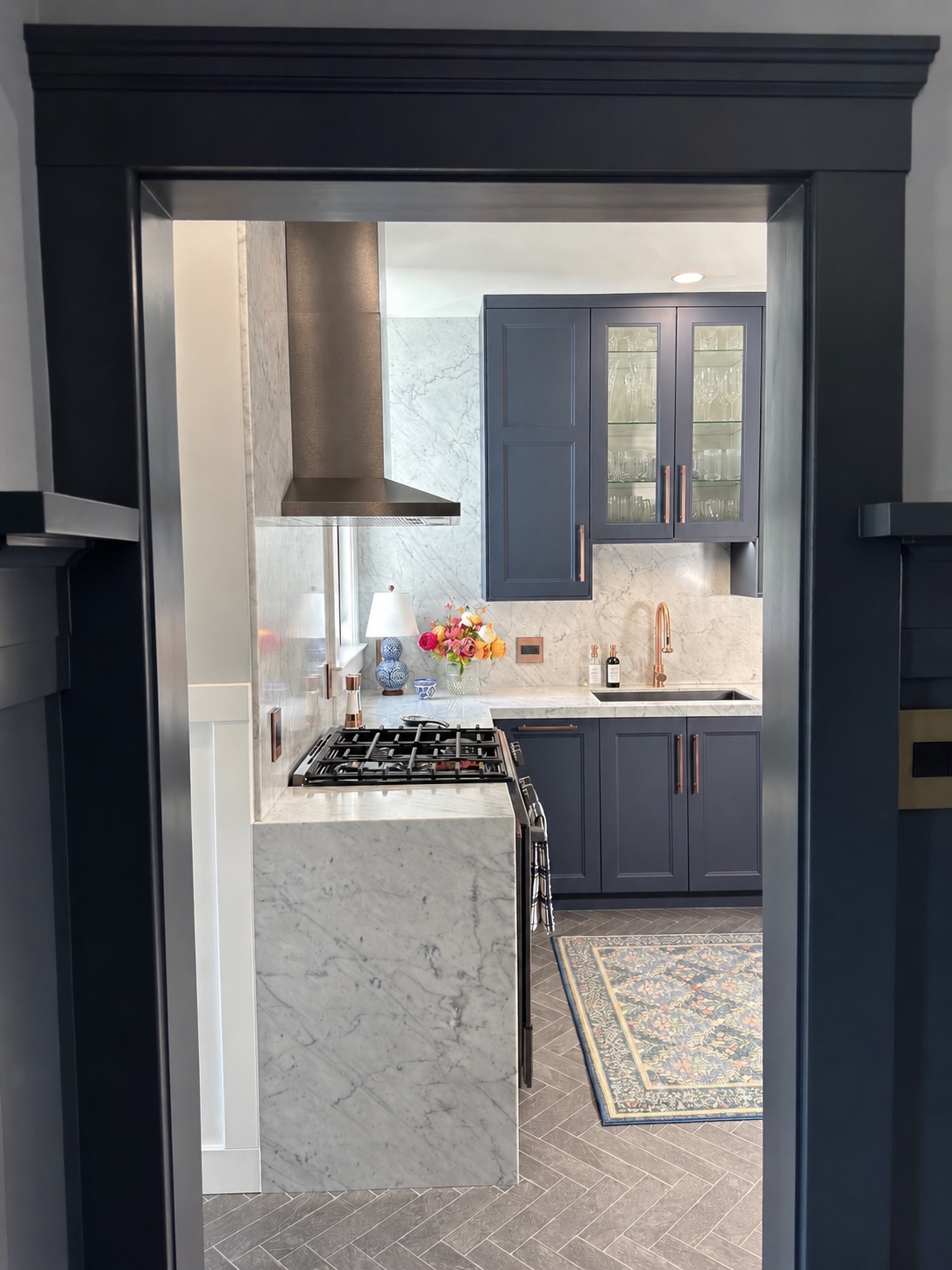 Sapphire and Marble - navy blue kitchen with floor to ceiling marble, antique copper hardware and double waterfall island, San Francisco Bay Area